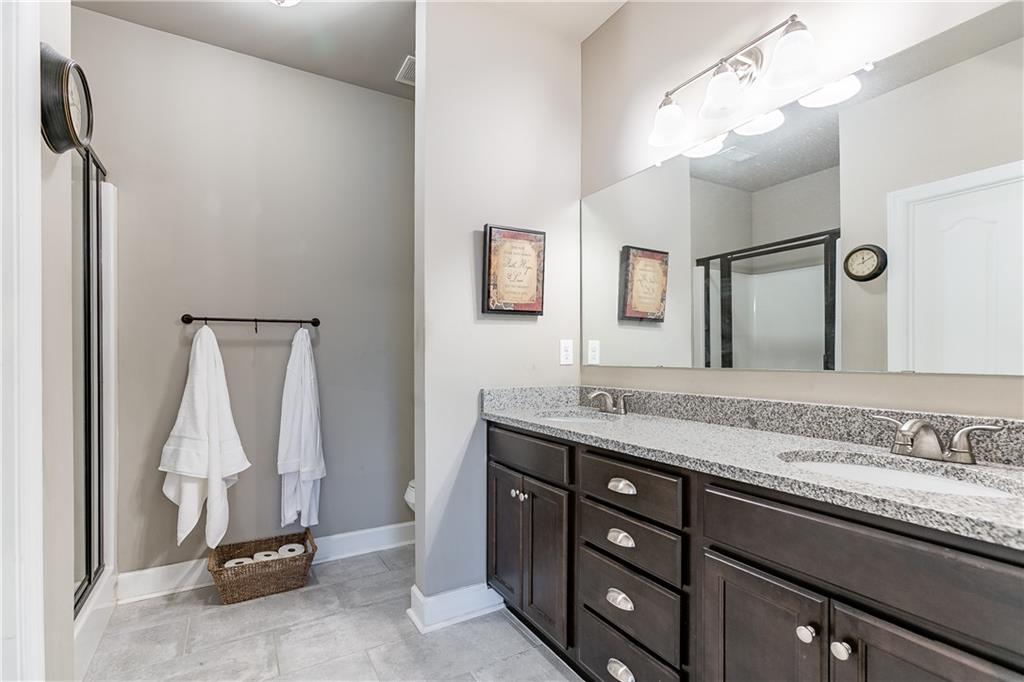 2875 Fox Wood Lane Gainesville, GA 30504 - Photo 15 of 24 a bathroom with a granite countertop sink and a mirror