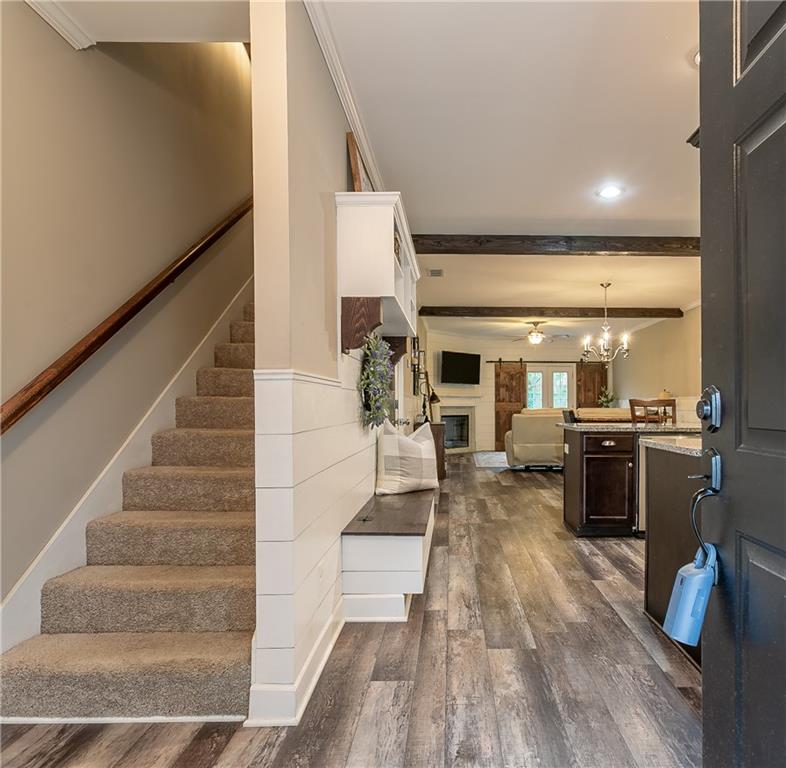 2875 Fox Wood Lane Gainesville, GA 30504 - Photo 2 of 24 a living room with couches and kitchen view with wooden floor