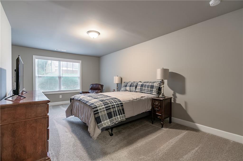 2875 Fox Wood Lane Gainesville, GA 30504 - Photo 22 of 24 a bedroom with a bed chair and window