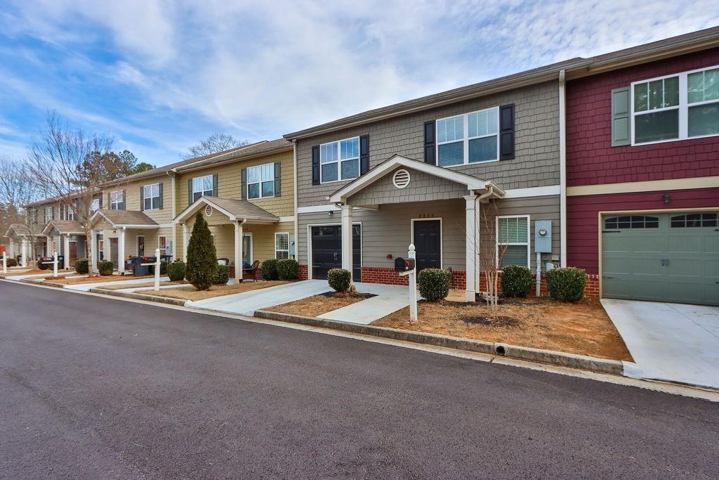 2875 Fox Wood Lane Gainesville, GA 30504 - Photo 24 of 24 a front view of a house with yard and parking