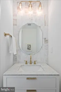 a bathroom with a sink and mirror
