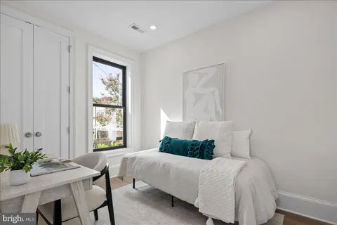 a bed room with a bed and a table