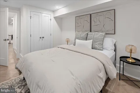 a large white bed in a white room