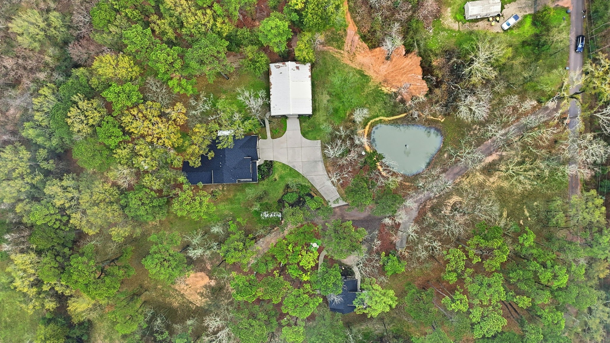 1480 Traylor Road Conroe, TX 77304 - Photo 25 of 25 an aerial view of residential house with outdoor space and trees all around