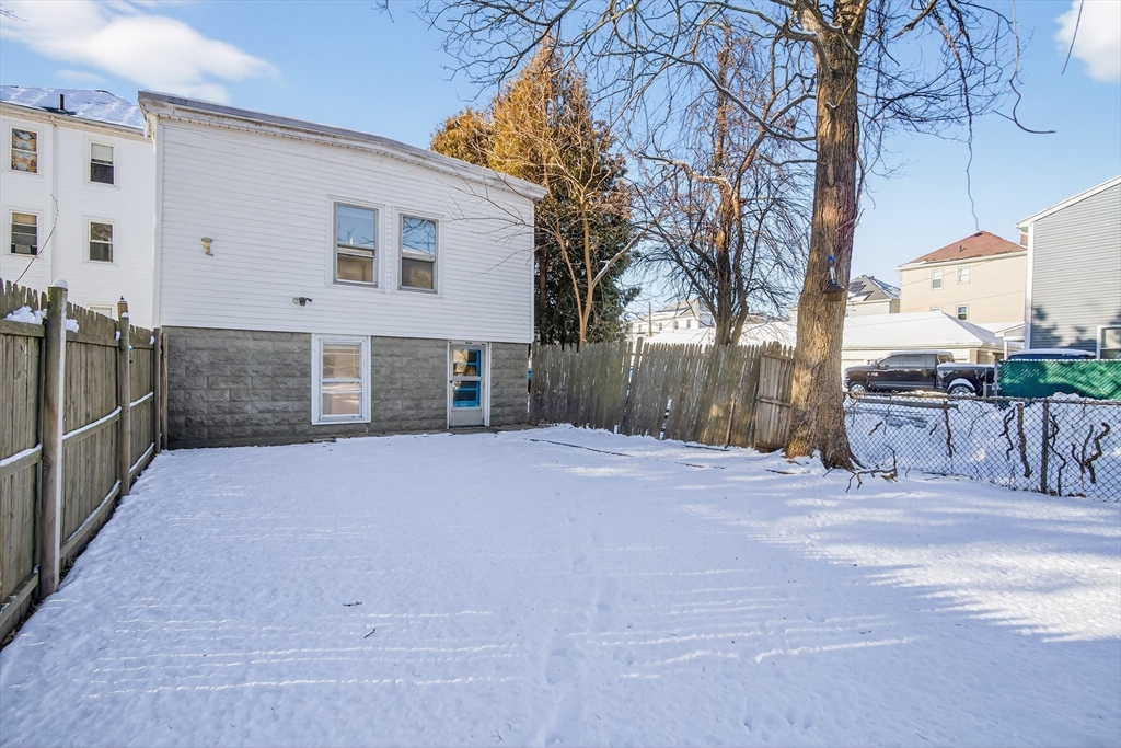 240 Montaup Street Fall River, MA 02724 - Photo 11 of 16 a view of a house with a yard