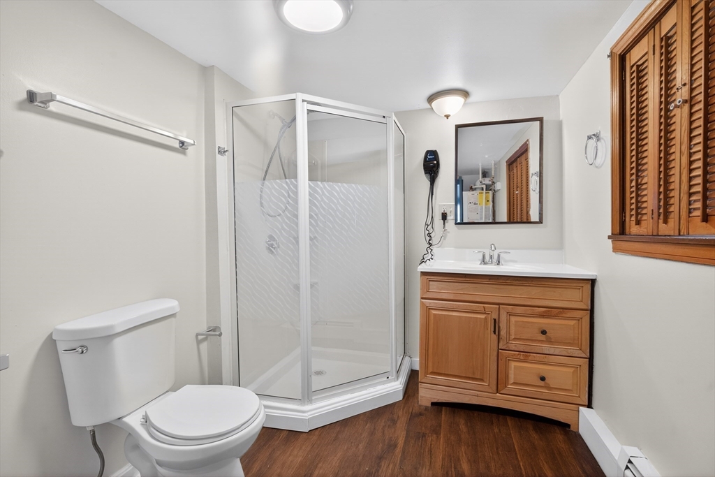 240 Montaup Street Fall River, MA 02724 - Photo 12 of 16 a bathroom with a granite countertop sink toilet and shower