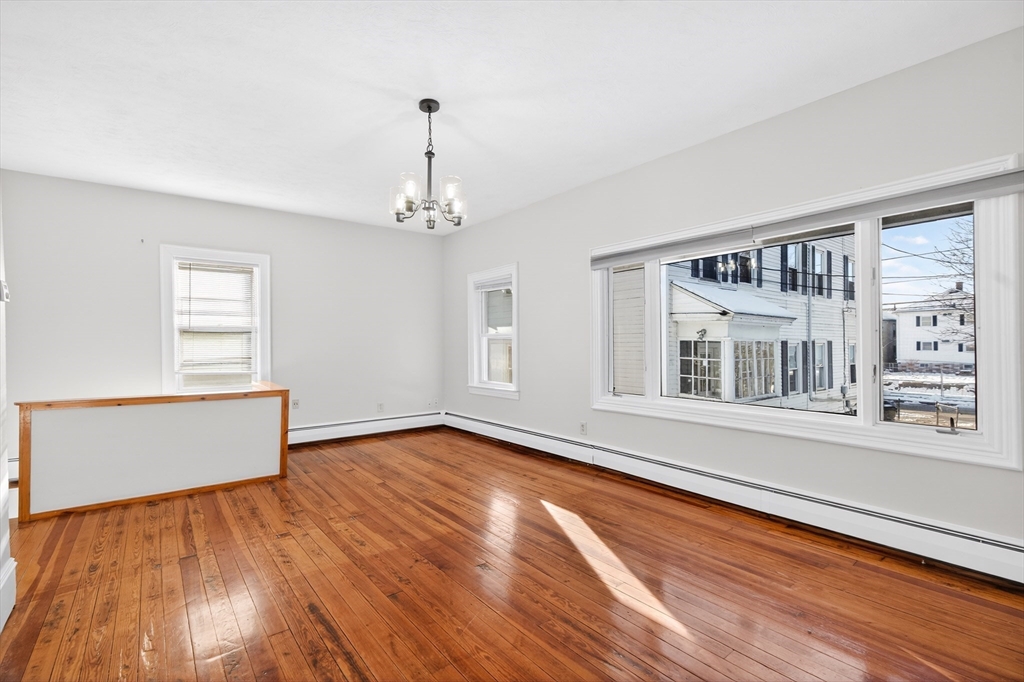 240 Montaup Street Fall River, MA 02724 - Photo 6 of 16 a view of an empty room with wooden floor and a window