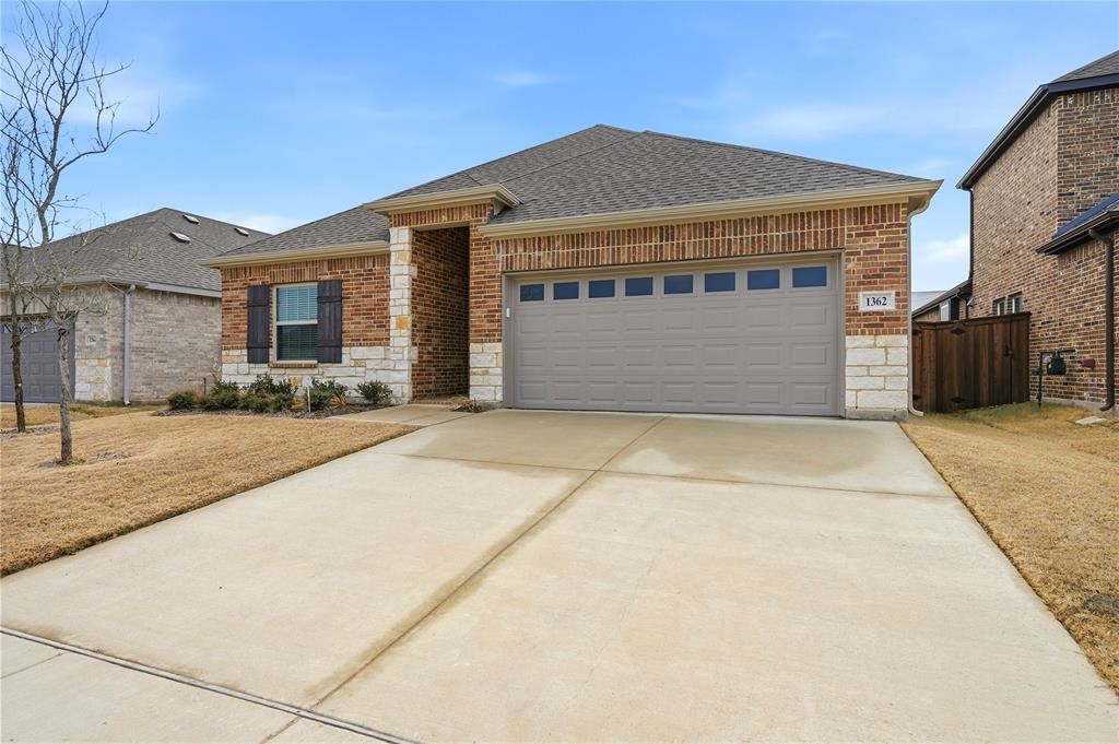 1362 Chisos Way Forney, TX 75126 - Photo 3 of 40 a front view of a house with a garage
