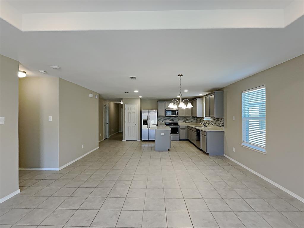 2220 Heaton Street Forney, TX 75126 - Photo 2 of 11 a view of a kitchen with furniture and a window