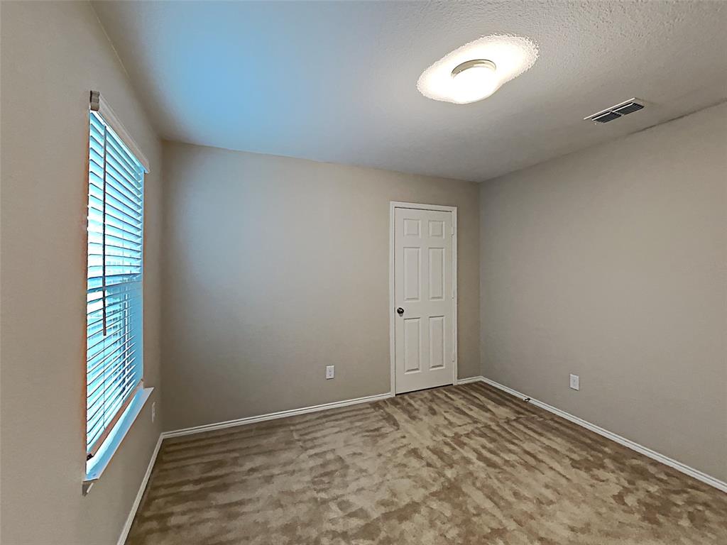 2220 Heaton Street Forney, TX 75126 - Photo 7 of 11 a view of empty room with window