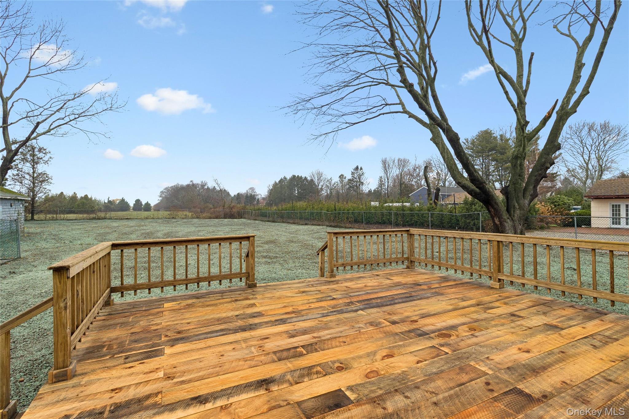 17425 County Road 48 Cutchogue, NY 11935 - Photo 11 of 30 Deck with a fenced backyard