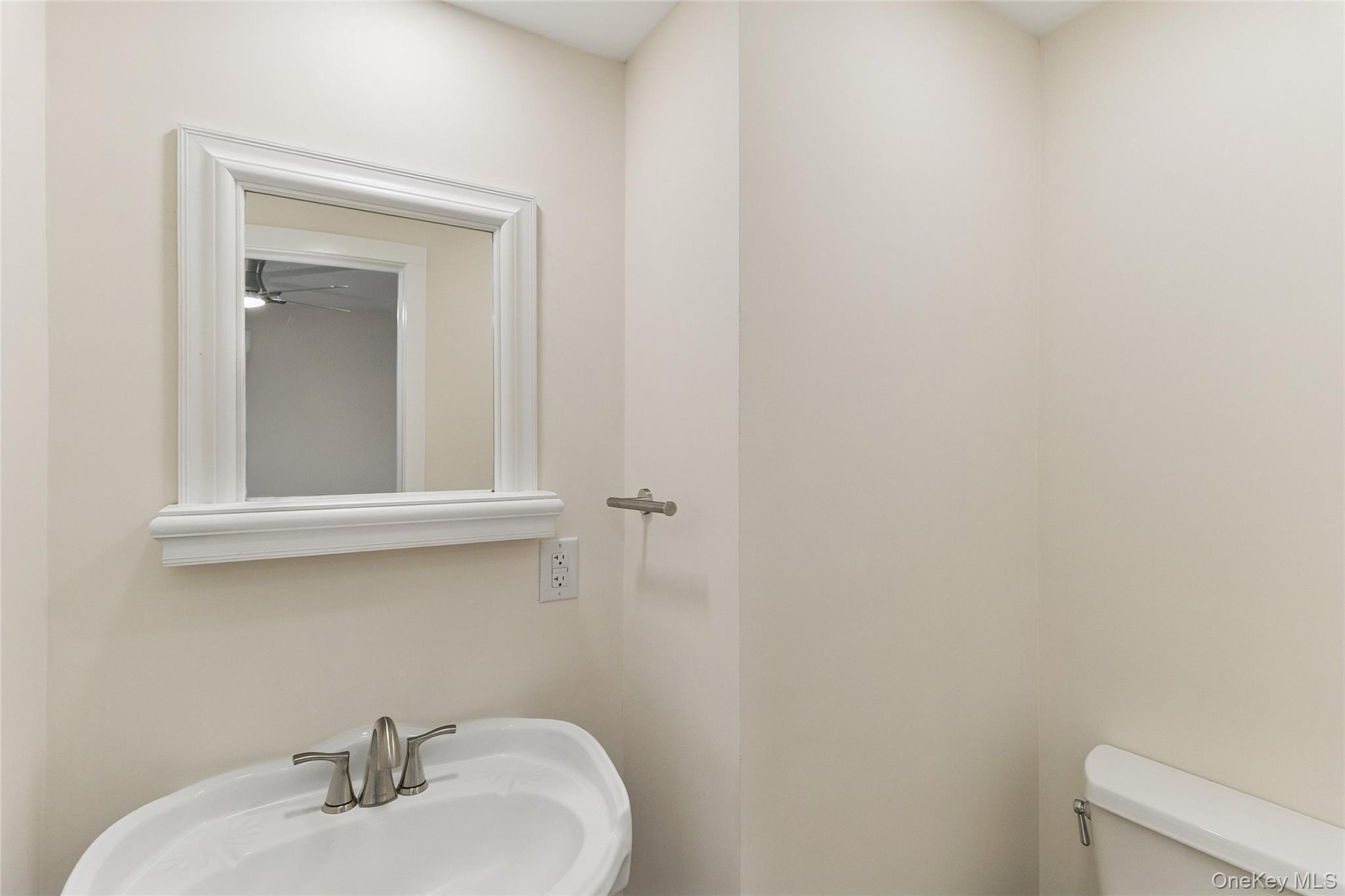 17425 County Road 48 Cutchogue, NY 11935 - Photo 15 of 30 Half bath with a sink and toilet