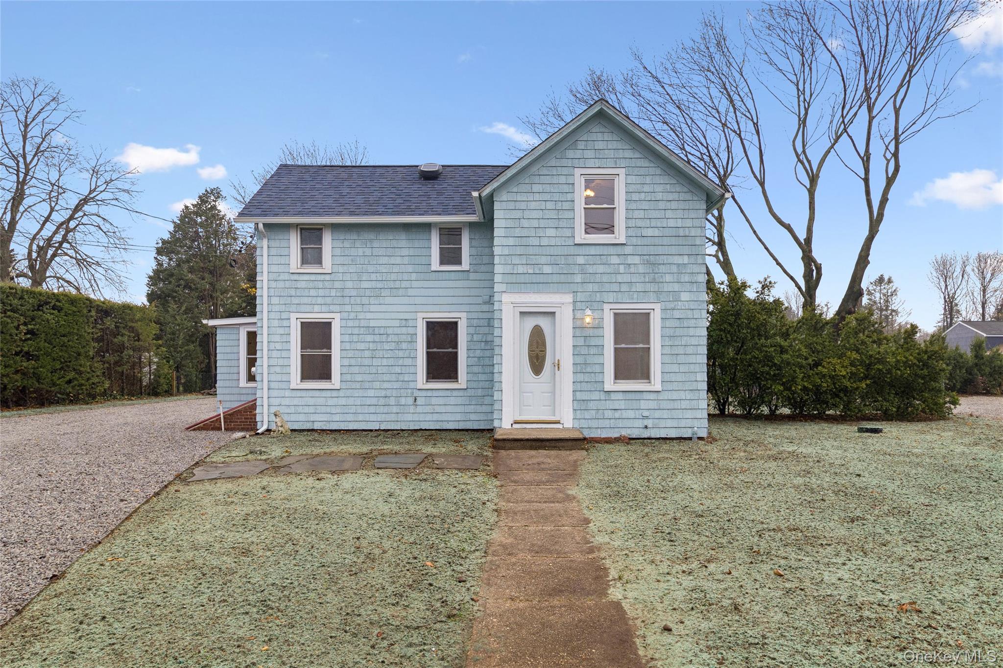17425 County Road 48 Cutchogue, NY 11935 - Photo 2 of 30 Traditional-style home featuring a shingled roof