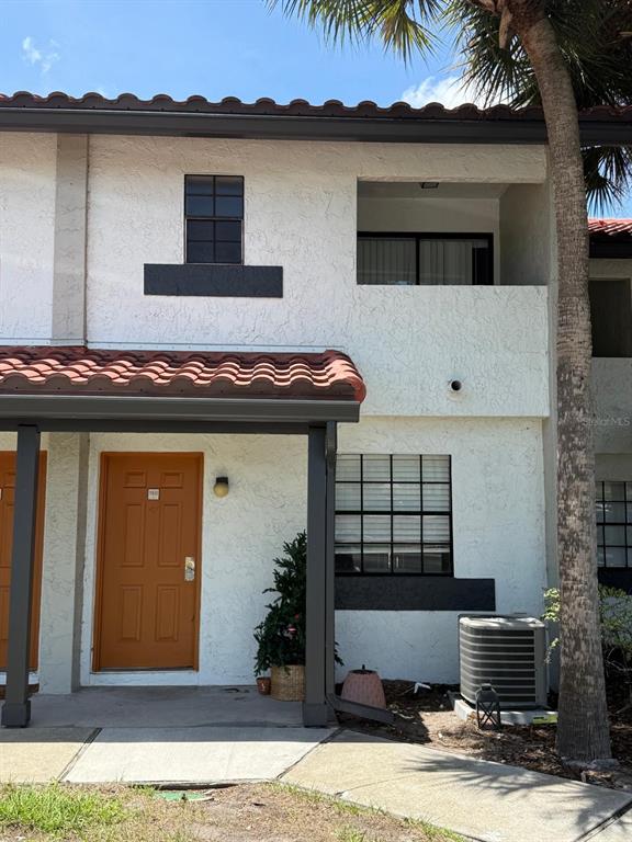 10260 Turkey Lake Road, Unit 150 (A30) Orlando, FL 32819 - Photo 13 of 13 a view of a house with a patio
