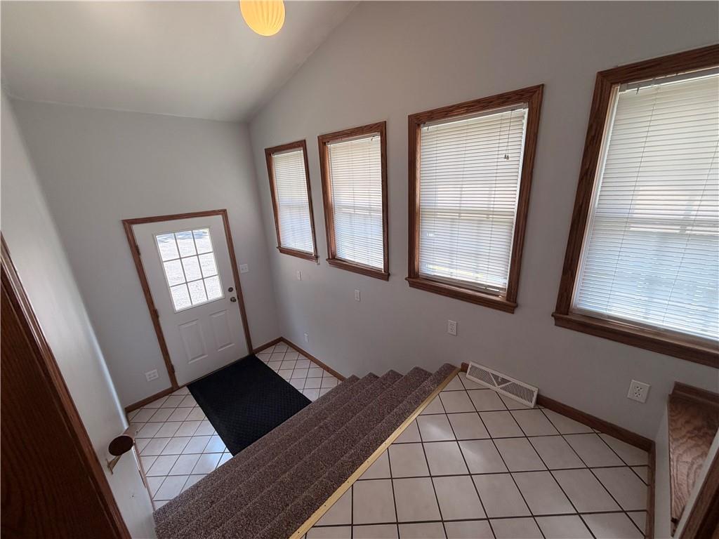 526 East River Road Edinburg, PA 16116 - Photo 9 of 45 a view of an empty room with window and hardwood floor