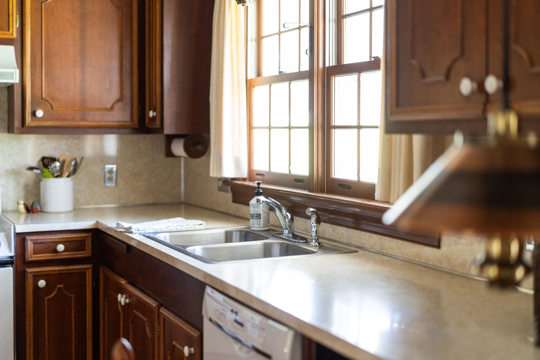813 Cattle Scales Road Waynesboro, VA 22980 - Photo 17 of 75 a kitchen with stainless steel appliances granite countertop a sink a window and a counter space