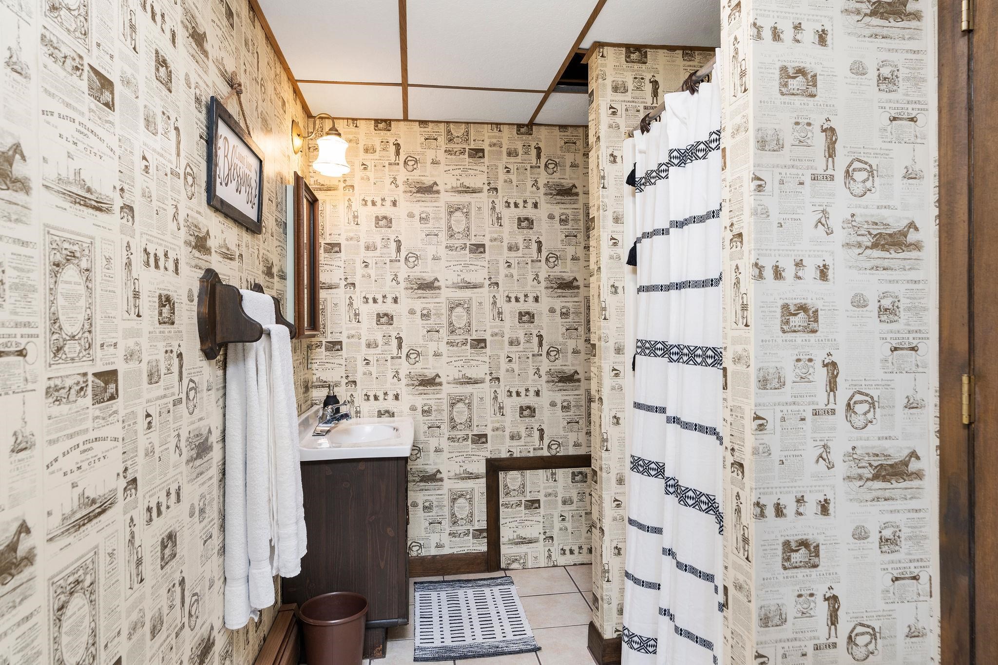 813 Cattle Scales Road Waynesboro, VA 22980 - Photo 48 of 75 a bathroom with a shower and a shower curtain