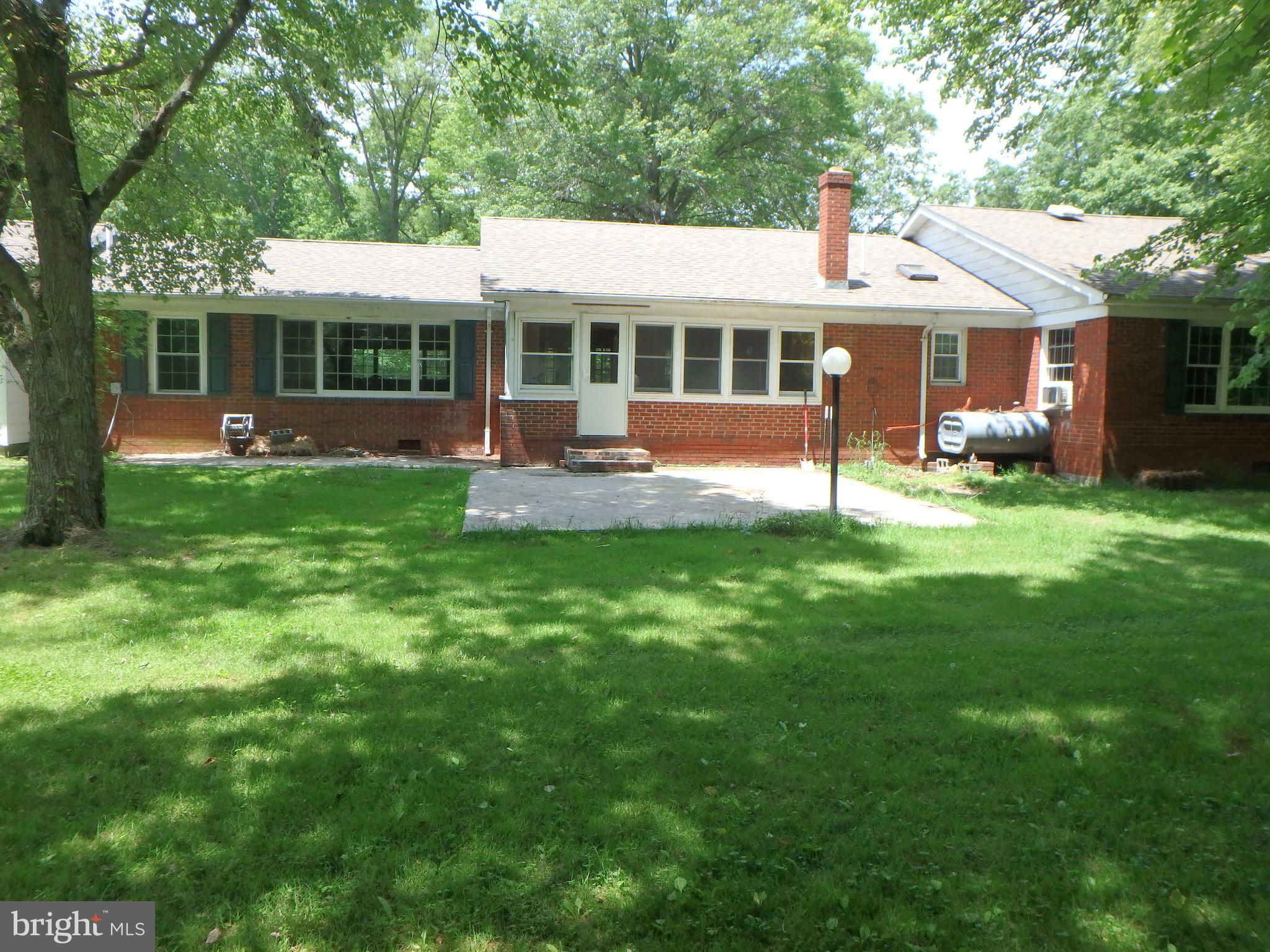 5299 Skinners Neck Road Rock Hall, MD 21661 - Photo 11 of 38 Exterior Rear showing sun room