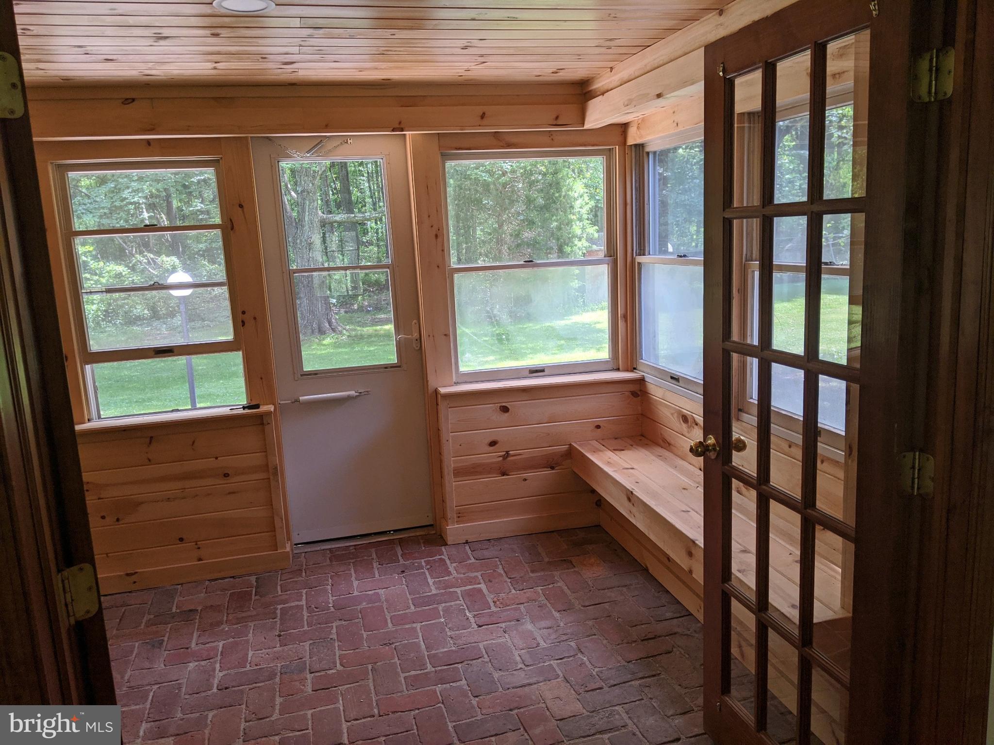 5299 Skinners Neck Road Rock Hall, MD 21661 - Photo 18 of 38 Newly paneled Knotty Pine Sun room