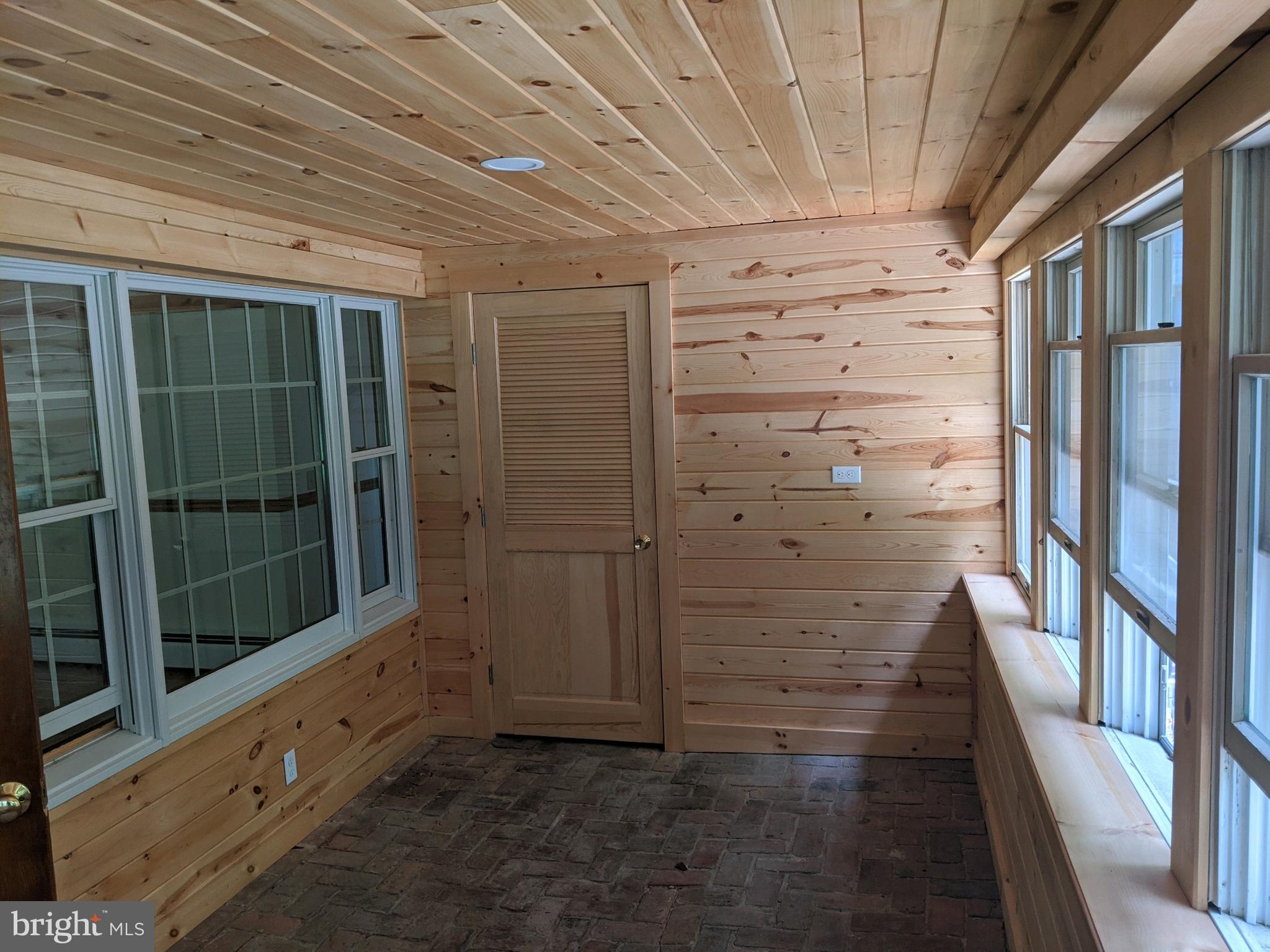 5299 Skinners Neck Road Rock Hall, MD 21661 - Photo 19 of 38 Newly paneled Knotty Pine Sun room
