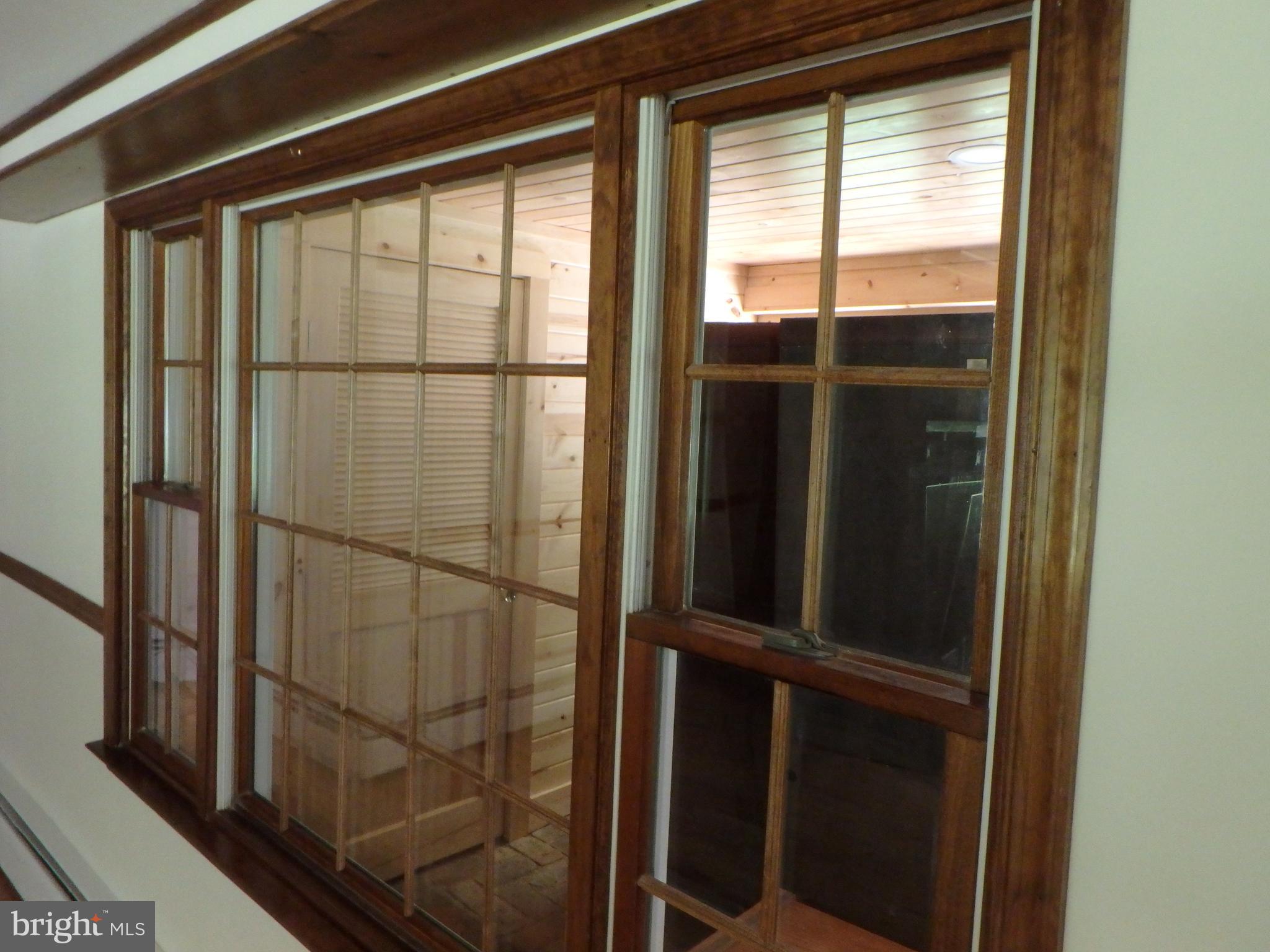 5299 Skinners Neck Road Rock Hall, MD 21661 - Photo 22 of 38 Window wall into the sunroom