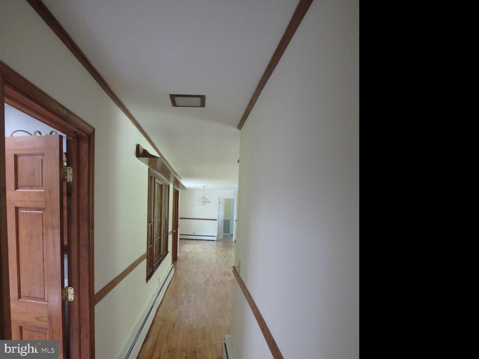 5299 Skinners Neck Road Rock Hall, MD 21661 - Photo 30 of 38 Hallway looking back to Kitchen