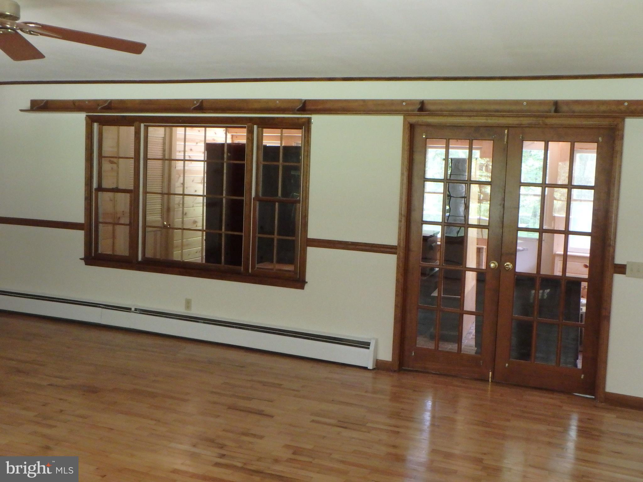 5299 Skinners Neck Road Rock Hall, MD 21661 - Photo 32 of 38 Window wall and french doors onto sunroom