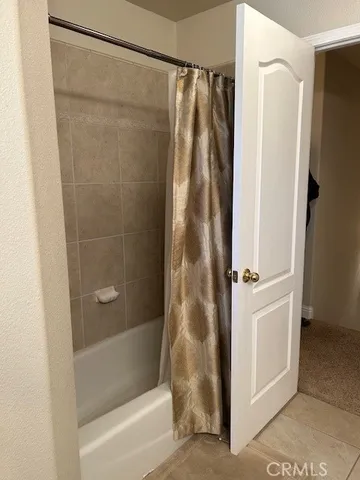 a view of a backyard with plants and a window