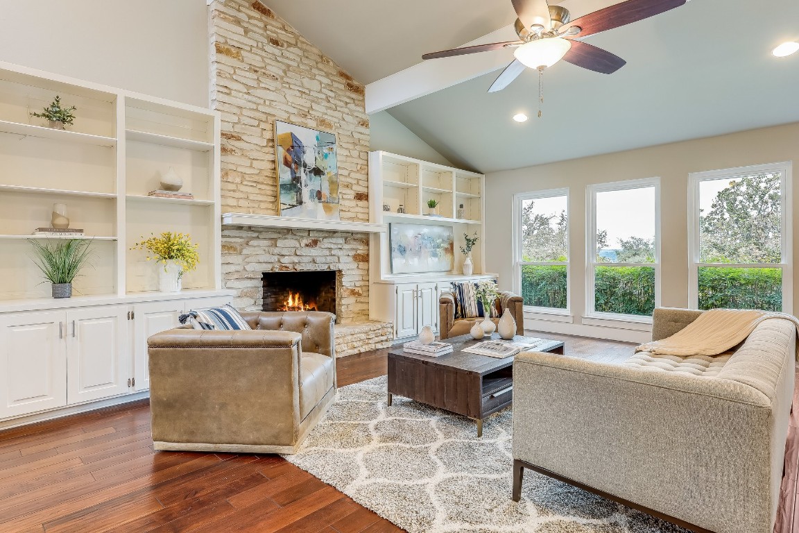 a living room with furniture and a fireplace