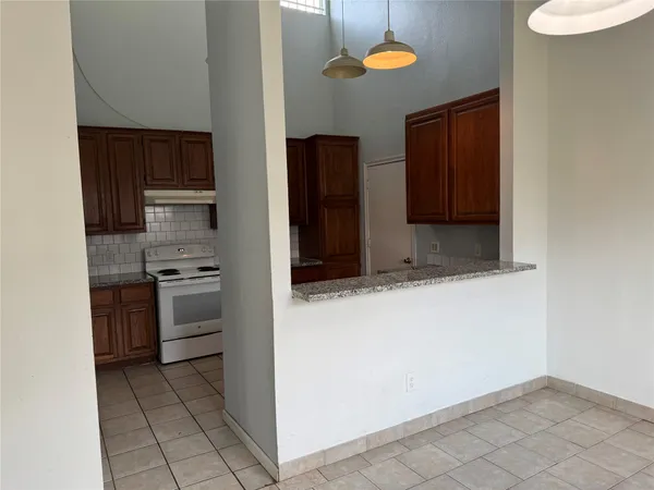 a kitchen with stainless steel appliances a stove and a refrigerator