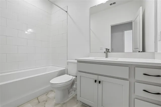 a bathroom with a sink a toilet and a bathtub