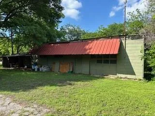 a view of a backyard of the house