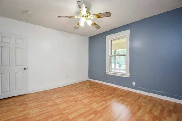 a view of an empty room with a window