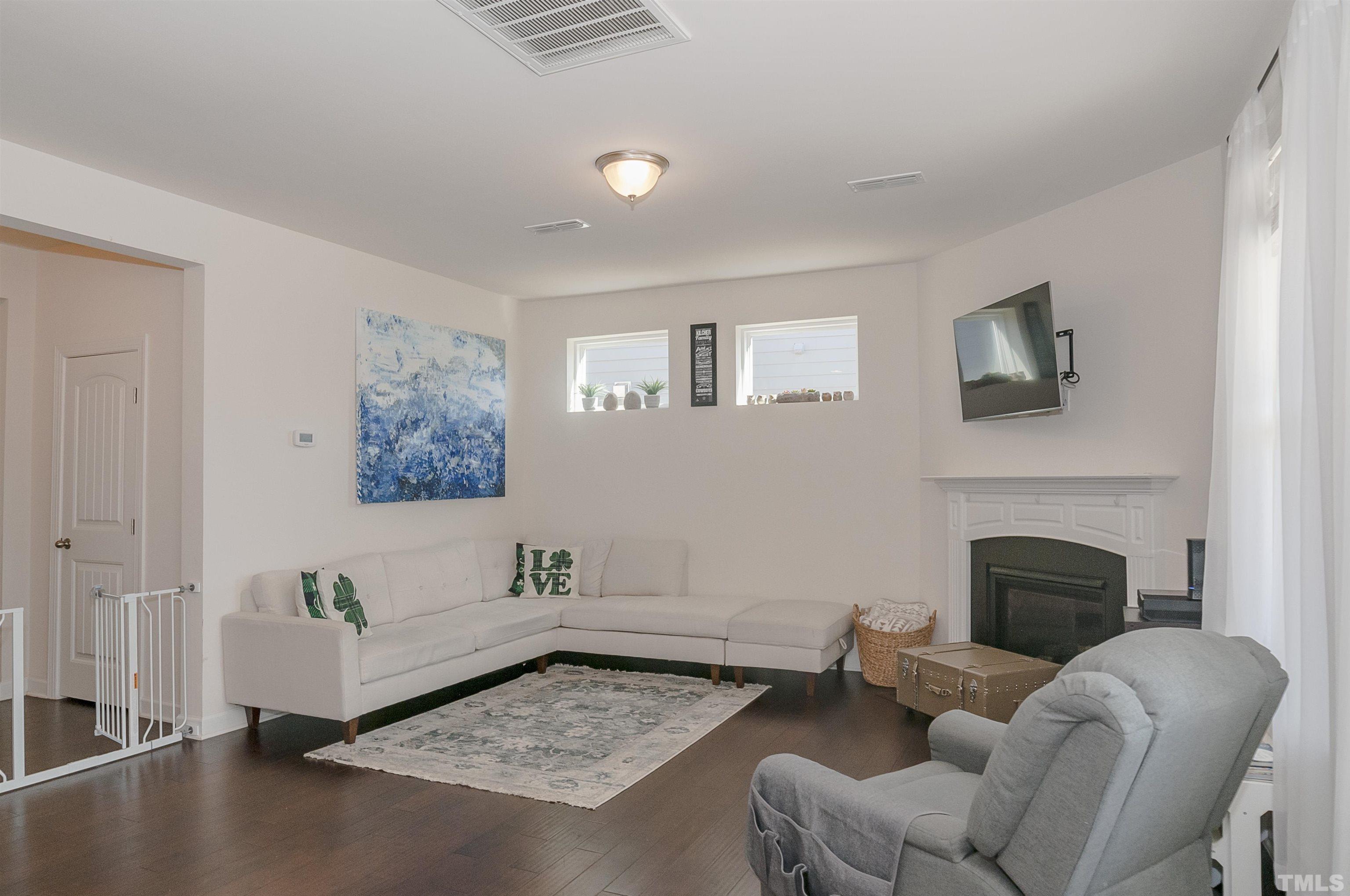 2011 Travern Drive, Unit 28 Raleigh, NC 27603 - Photo 6 of 36 a living room with furniture and a fireplace