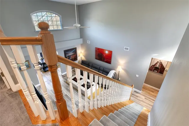 an aerial view of a house with a yard