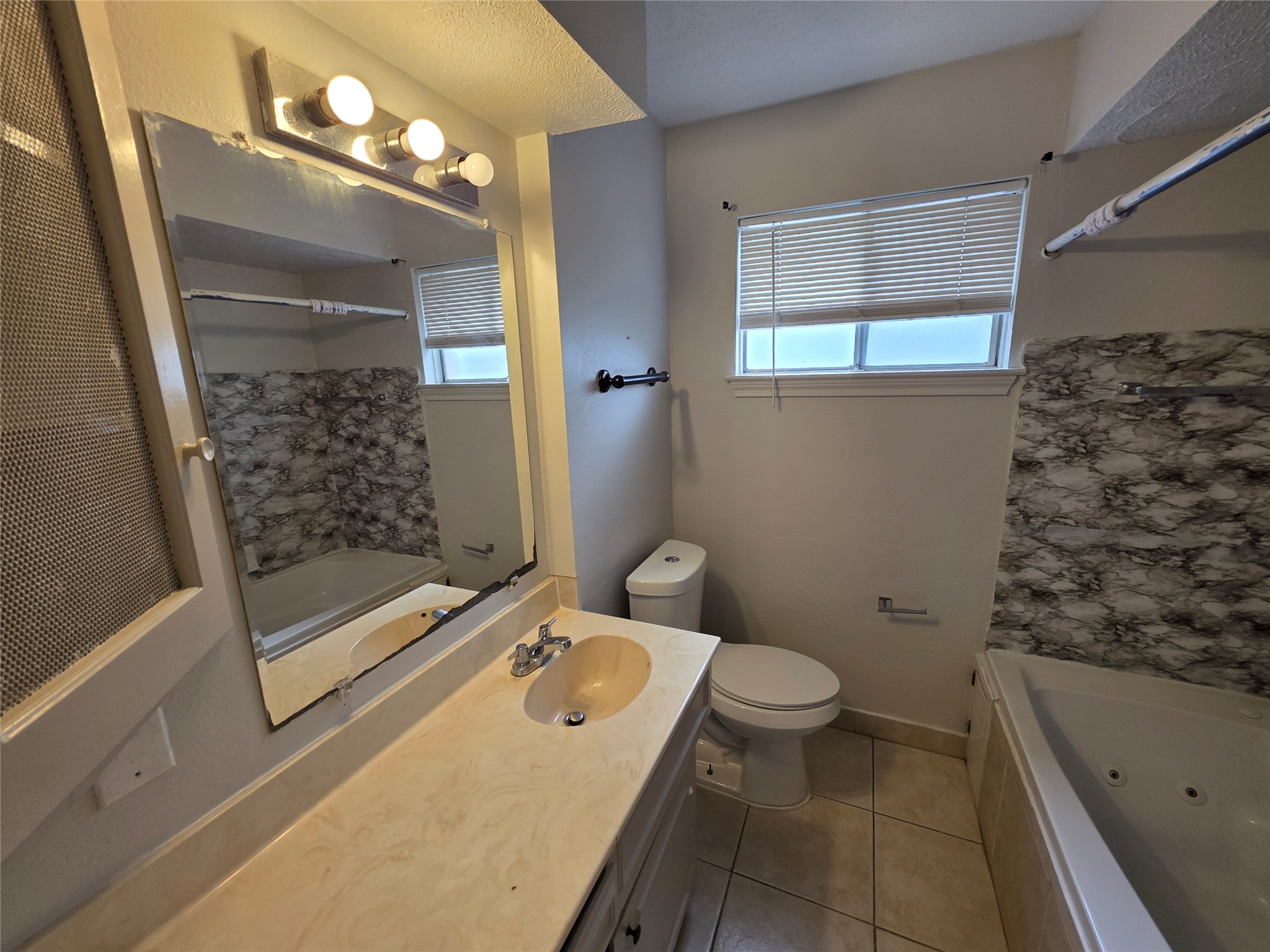 3414 Bristlecone Trail Spring, TX 77380 - Photo 11 of 16 a bathroom with a granite countertop sink toilet and shower