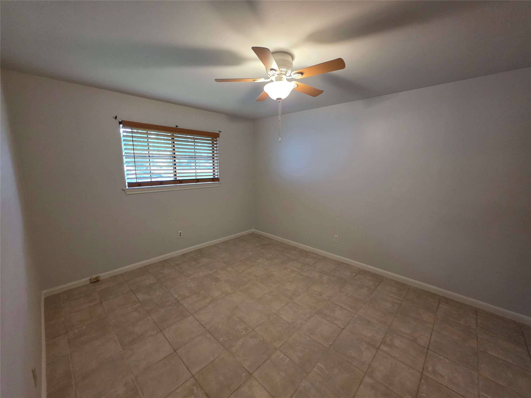 3414 Bristlecone Trail Spring, TX 77380 - Photo 13 of 16 an empty room with windows and fan