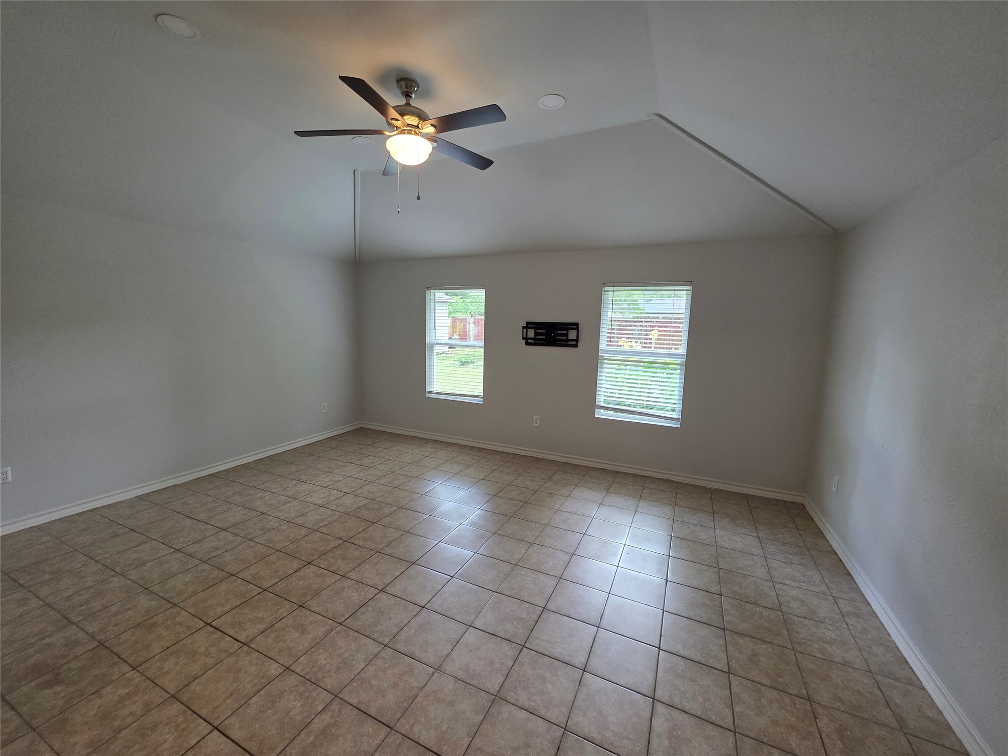 3414 Bristlecone Trail Spring, TX 77380 - Photo 7 of 16 an empty room with windows and fan