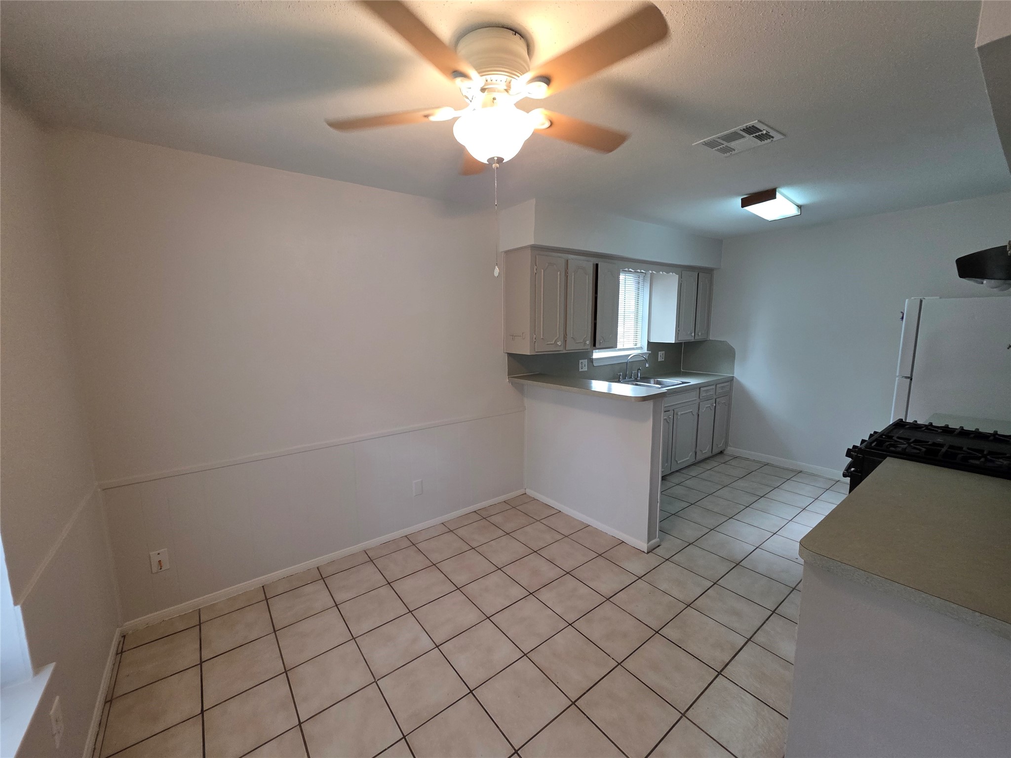 3414 Bristlecone Trail Spring, TX 77380 - Photo 8 of 16 a kitchen with granite countertop a sink stainless steel appliances and cabinets