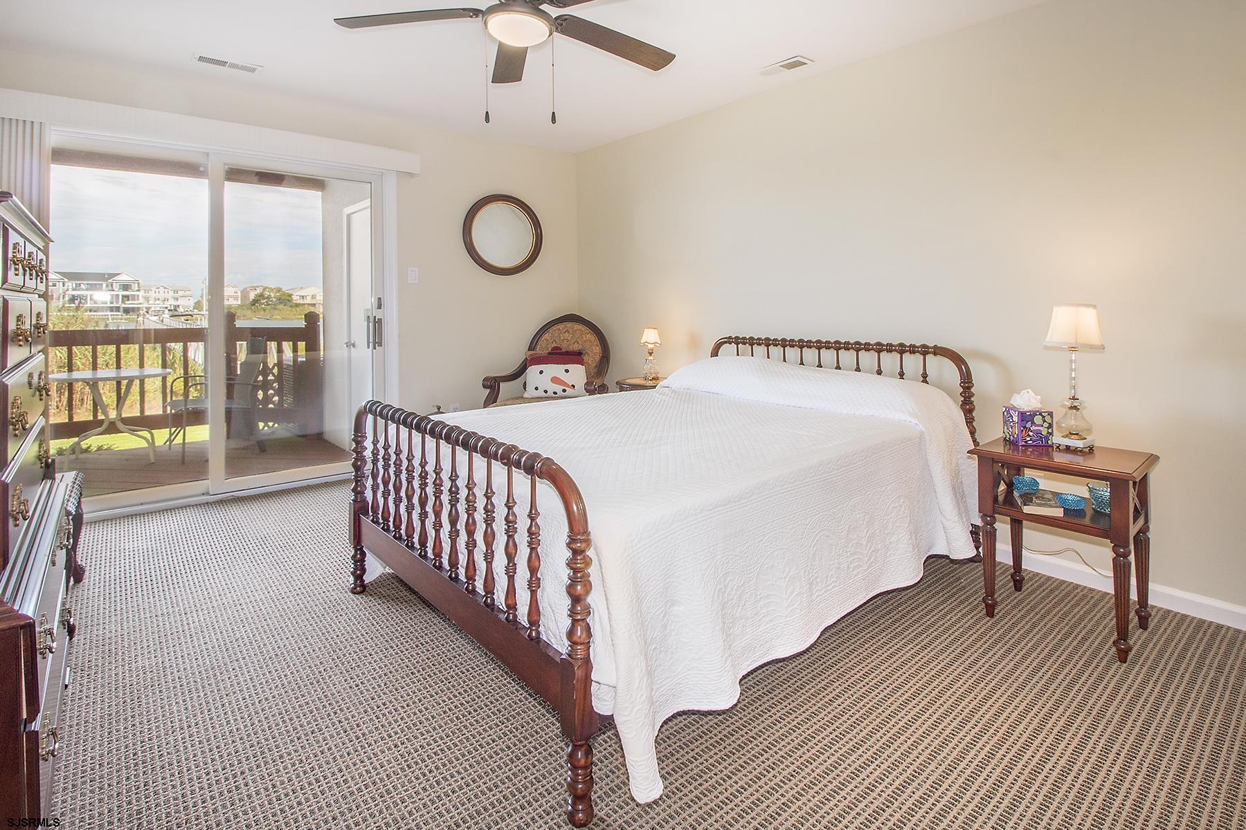 317 Gull Cove Brigantine, NJ 08203 - Photo 12 of 39 a bedroom with a bed and a table