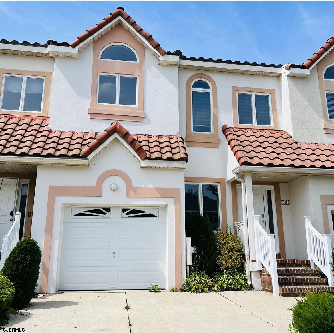 317 Gull Cove Brigantine, NJ 08203 - Photo 2 of 39 a front view of a house with a yard