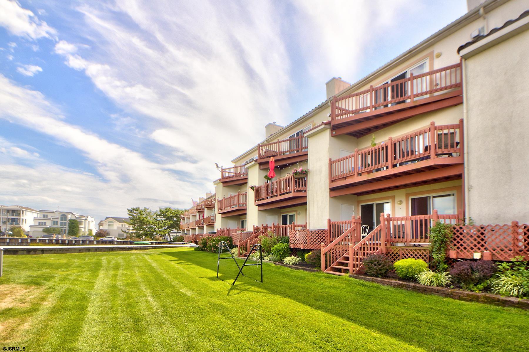 317 Gull Cove Brigantine, NJ 08203 - Photo 22 of 39 a view of an chairs and table on the patio
