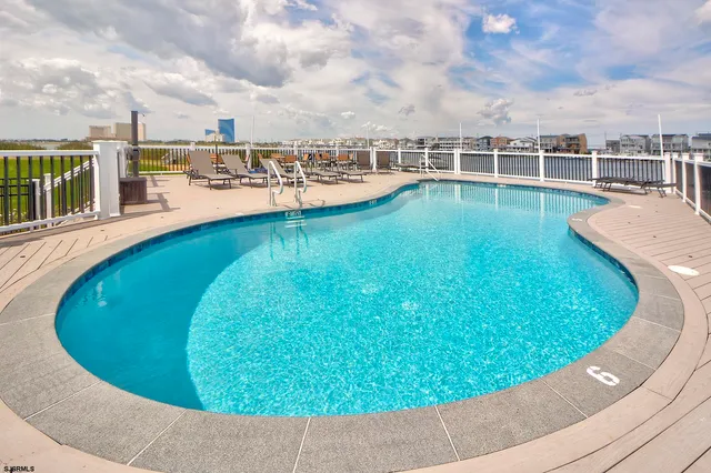 a view of a swimming pool with a garden