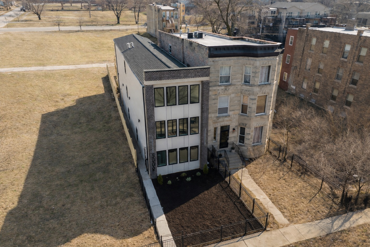 5809 South Indiana Avenue, Unit 2 Chicago, IL 60637 - Photo 2 of 18 a view of a balcony with wooden floor and city view