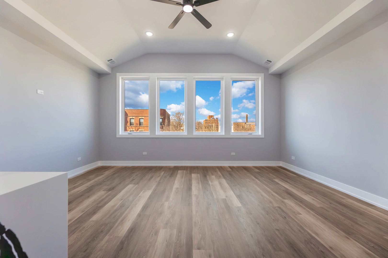 5809 South Indiana Avenue, Unit 2 Chicago, IL 60637 - Photo 4 of 18 wooden floor in an empty room with a window