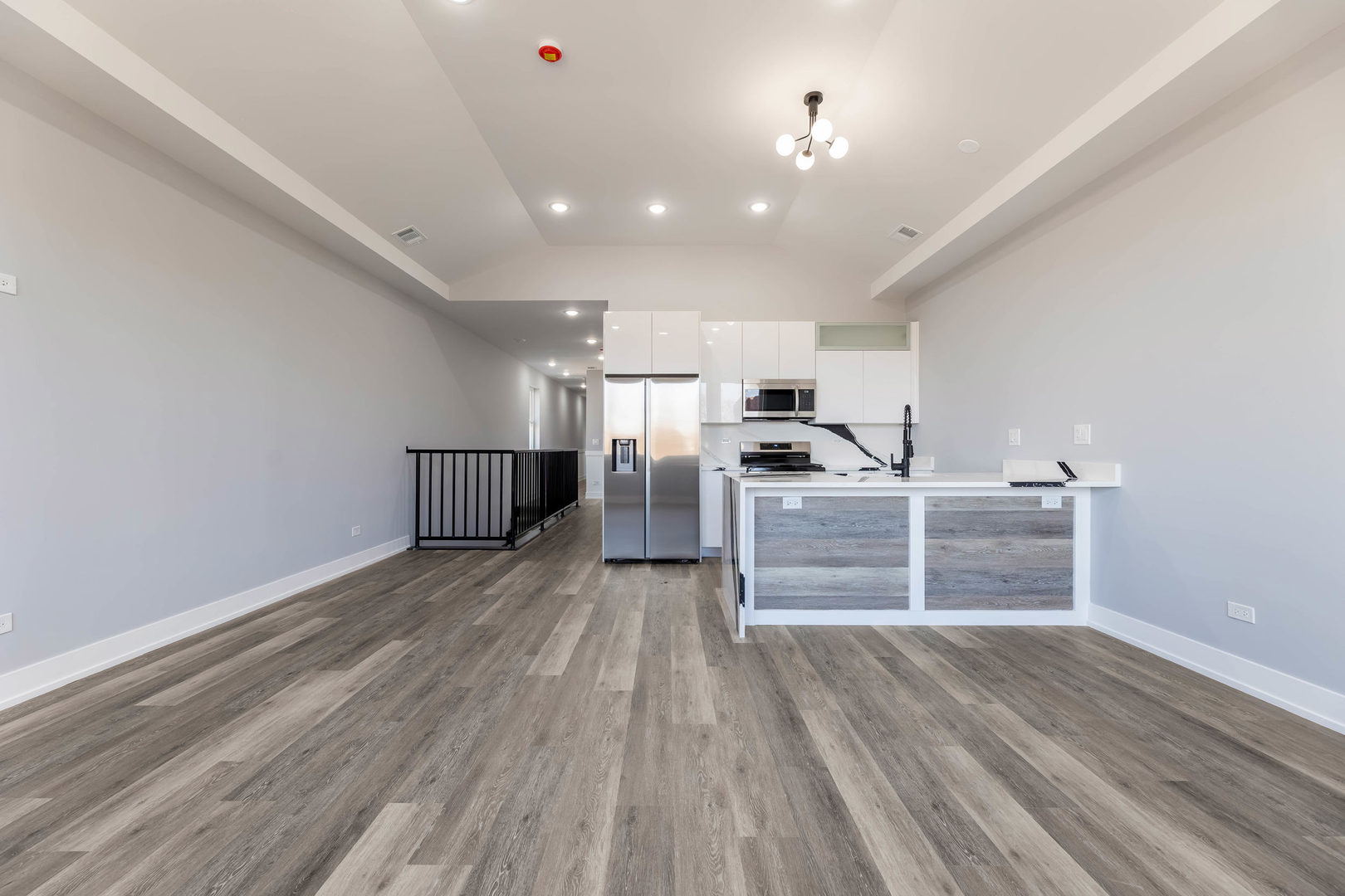5809 South Indiana Avenue, Unit 2 Chicago, IL 60637 - Photo 7 of 18 a view of a room with wooden floor and electronic appliances
