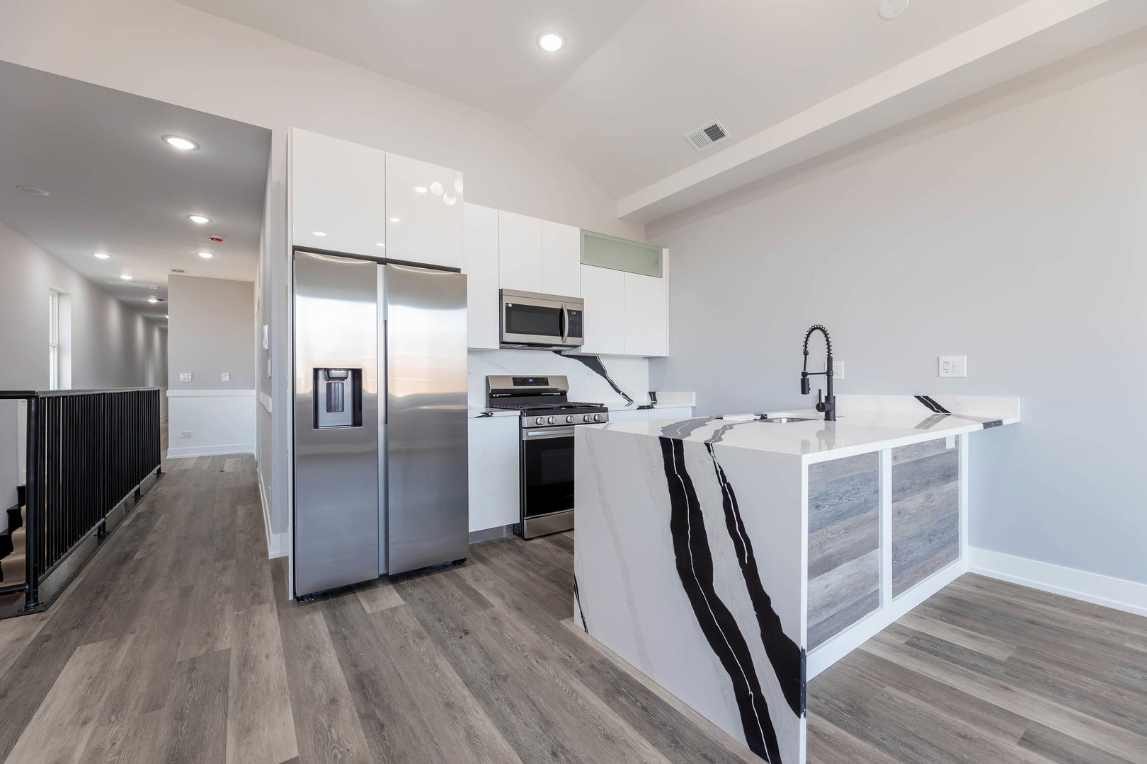 5809 South Indiana Avenue, Unit 2 Chicago, IL 60637 - Photo 8 of 18 a kitchen with stainless steel appliances a refrigerator and a sink