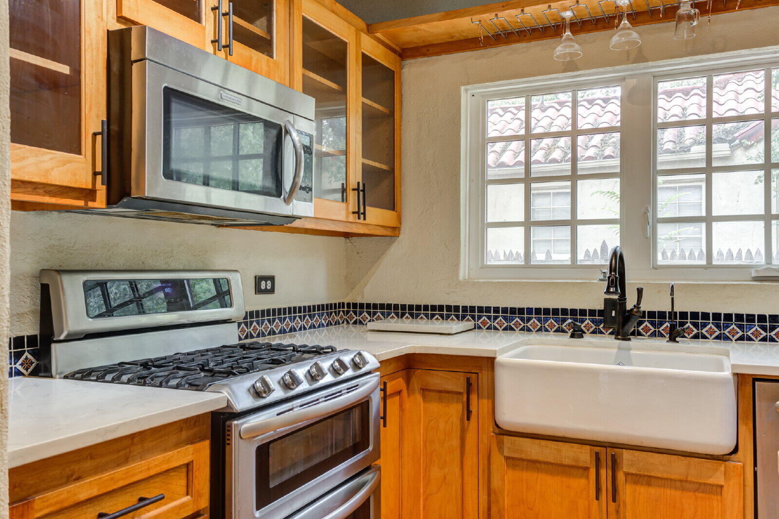 2305 18th Street, Unit FRONT Lubbock, TX 79401 - Photo 25 of 73 a view of a kitchen with a stove and a sink