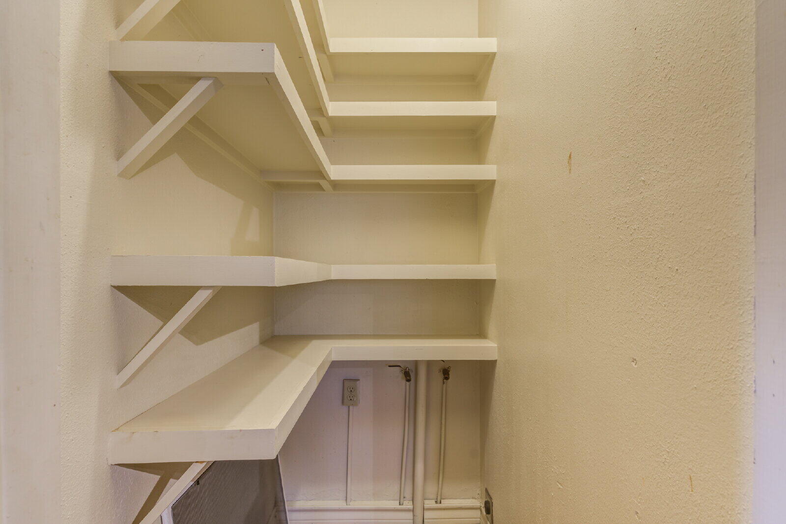 2305 18th Street, Unit FRONT Lubbock, TX 79401 - Photo 30 of 73 a view of walk in closet with empty racks
