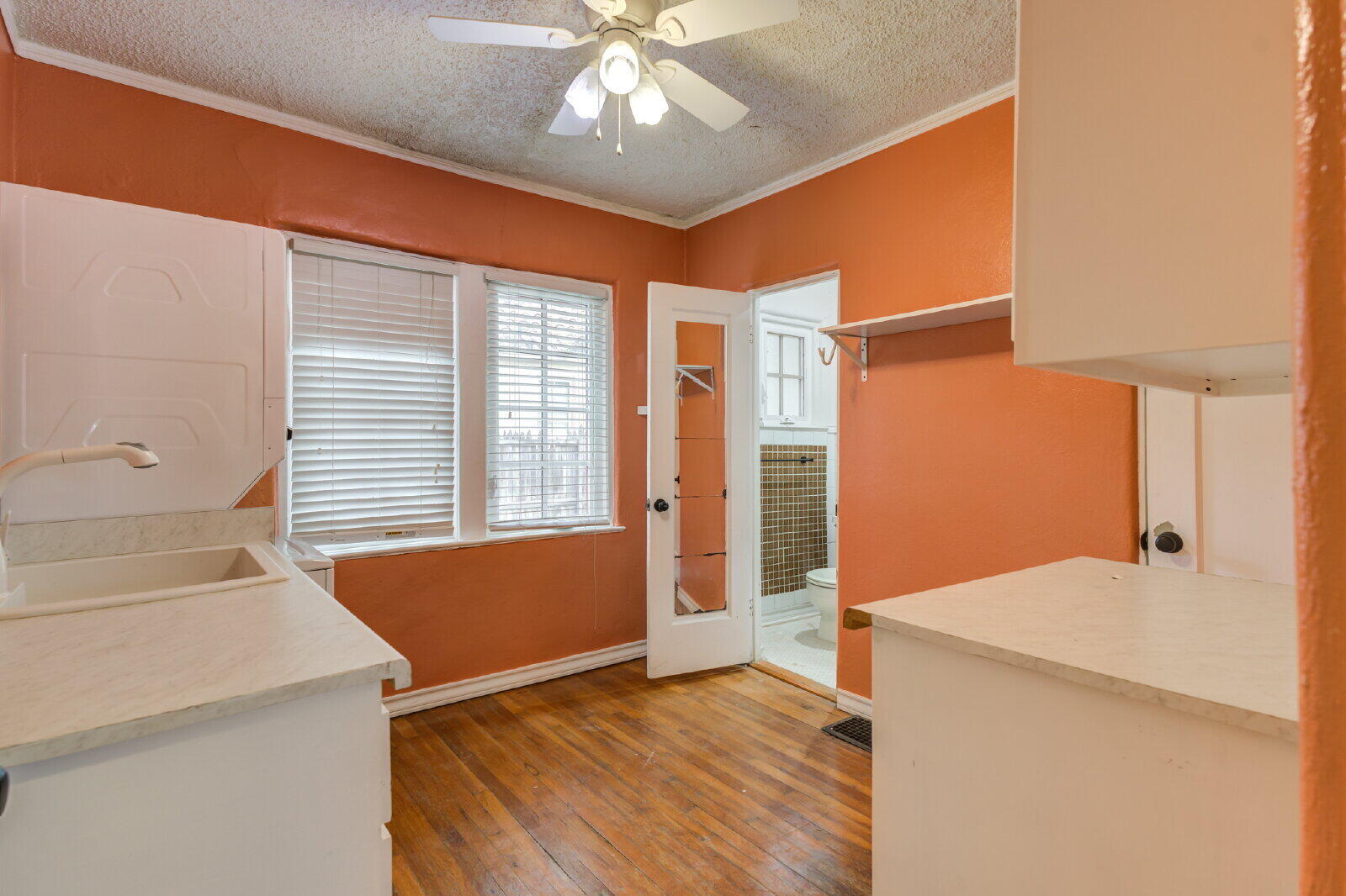 2305 18th Street, Unit FRONT Lubbock, TX 79401 - Photo 39 of 73 a view of bathroom with a sink and a mirror